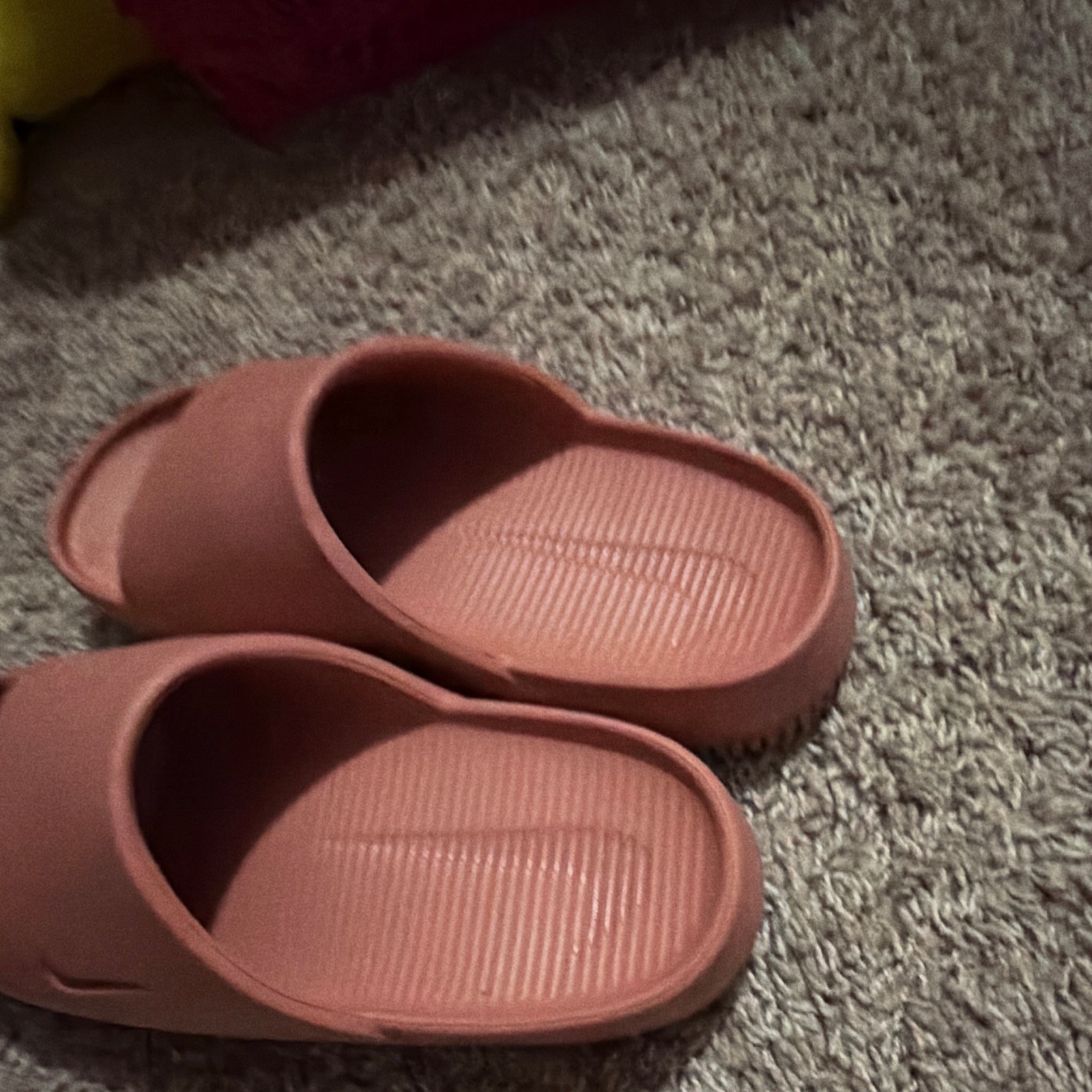 Pink Nike slides